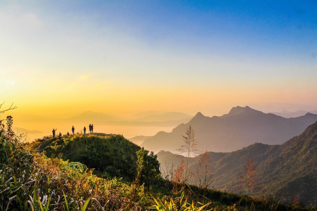 Services photo of people standing on top of mountain near grasses 733162.jpg
