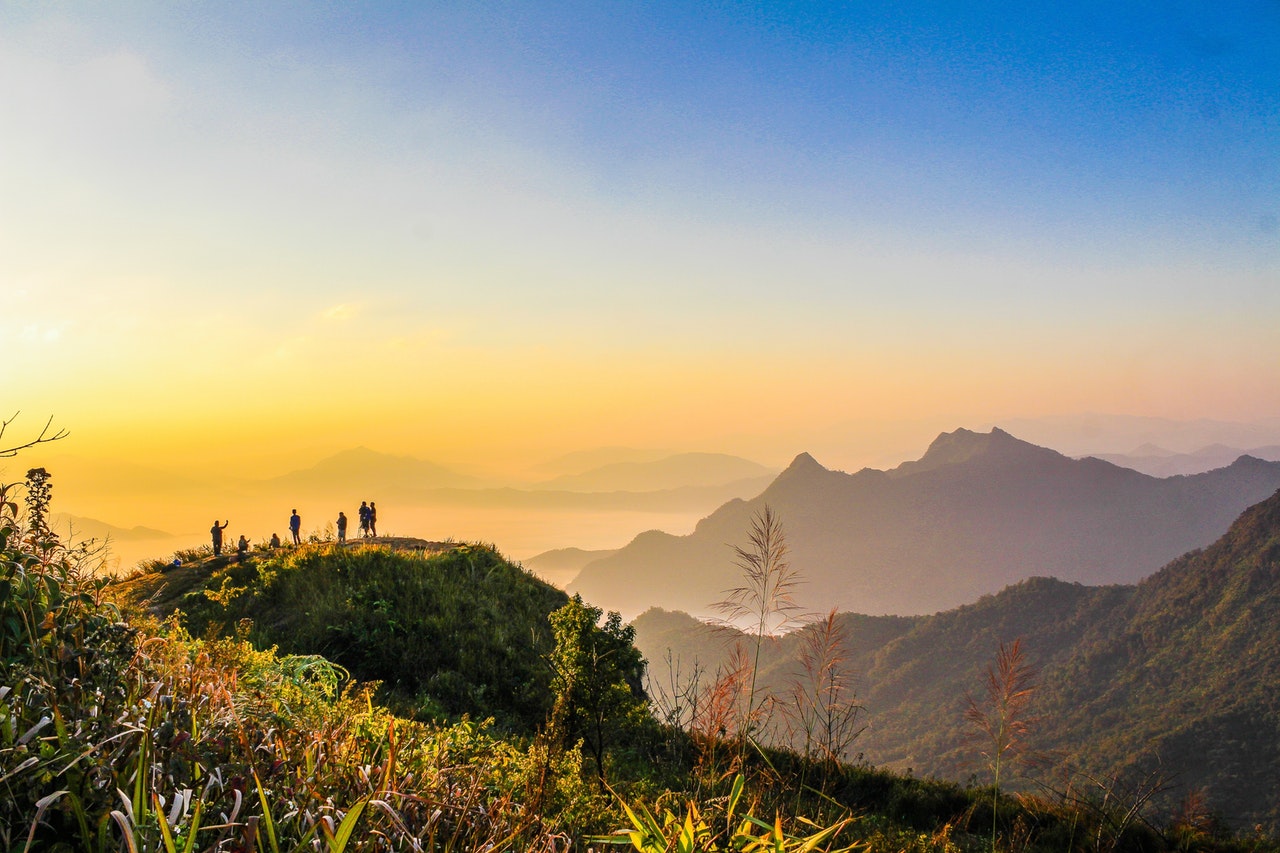 Home photo of people standing on top of mountain near grasses 733162.jpg
